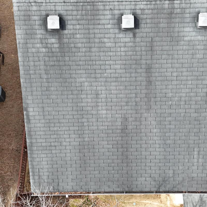 3-tab roof with faded slate shingles and missing shingles