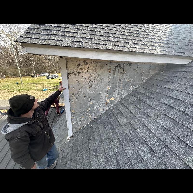 Siding and flashing removal on roof leak area