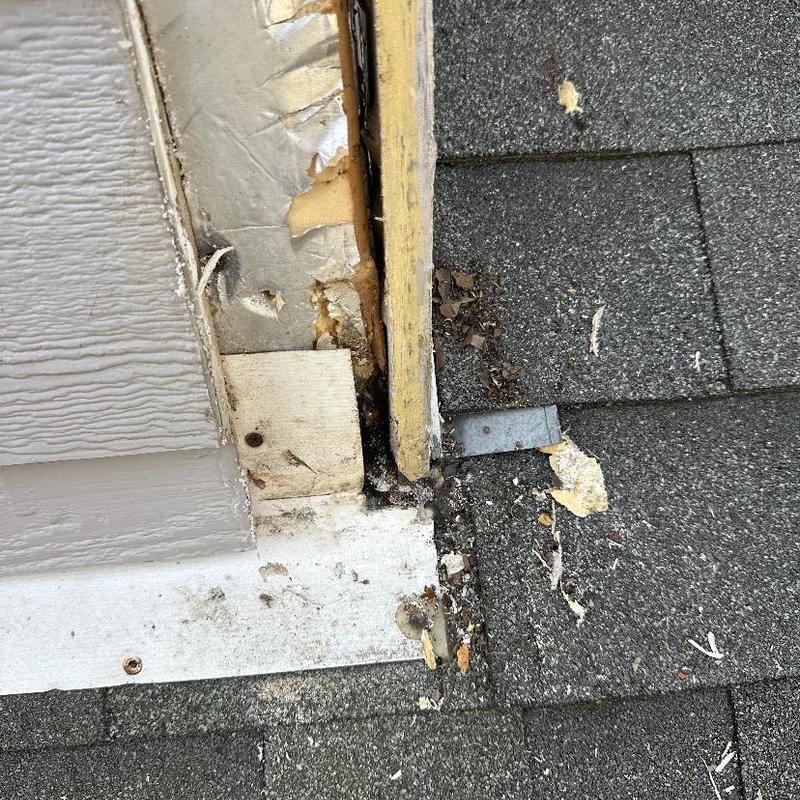Siding and flashing removal at roof edge with leaks
