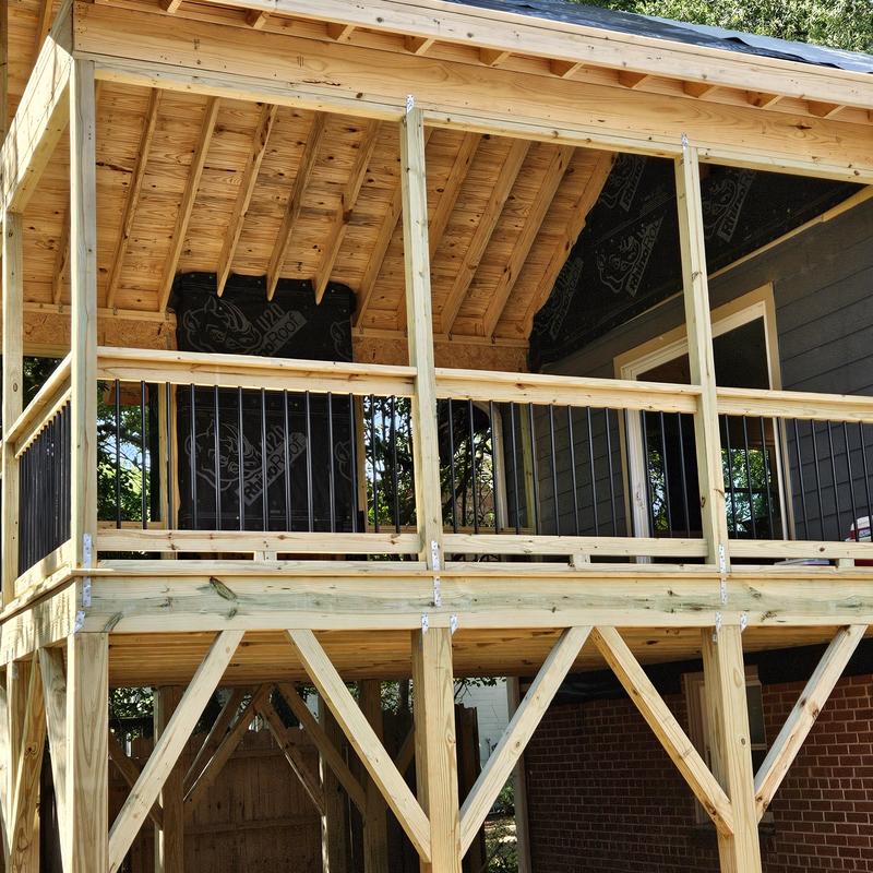 Three-season screened porch framing and railing installation Three-season screened porch framing and railing installation