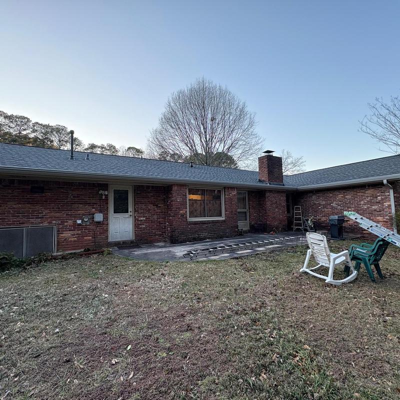 Seamless gutters and gutter helmets installation on house