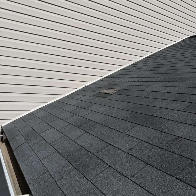 Slate 3-tab roof with one missing shingle