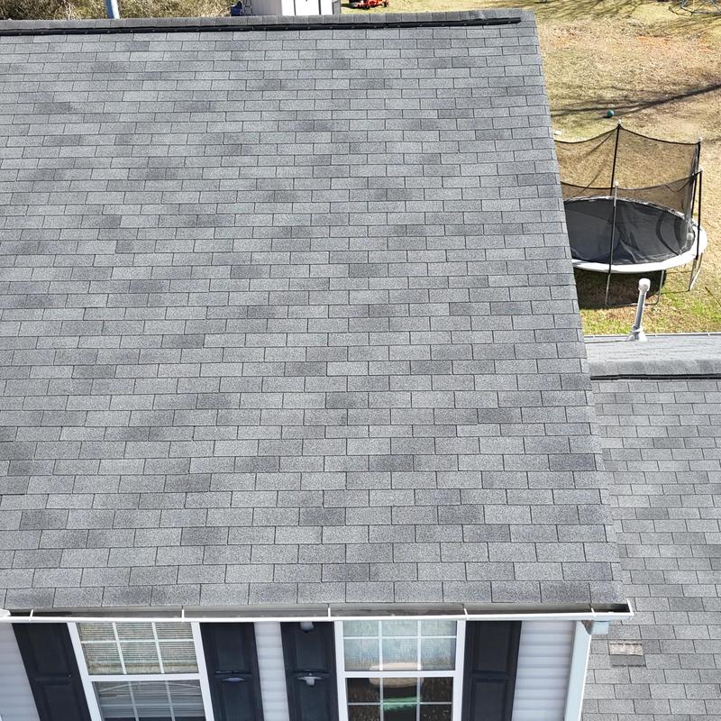 Three-tab slate roof with one missing shingle