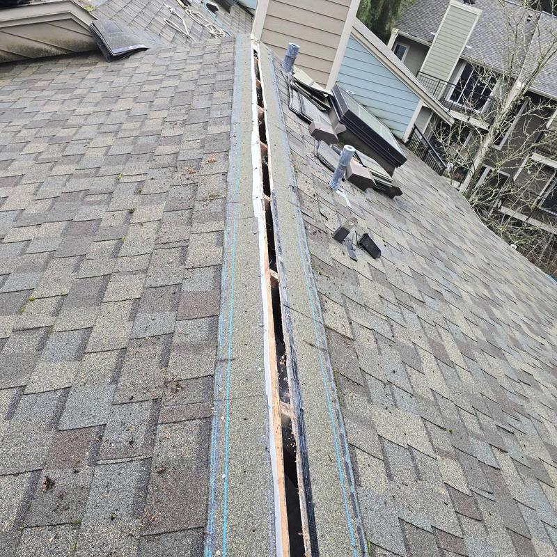 Roof ridge vent removed for replacement on shingle roof