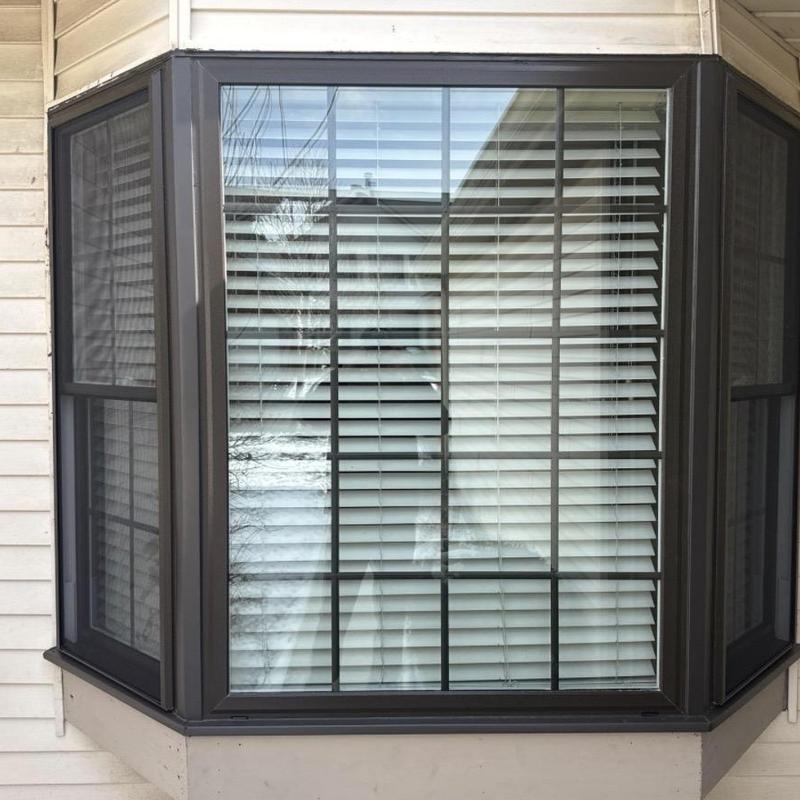 VinylMax double hung bay window with blinds installed VinylMax double hung bay window with blinds installed