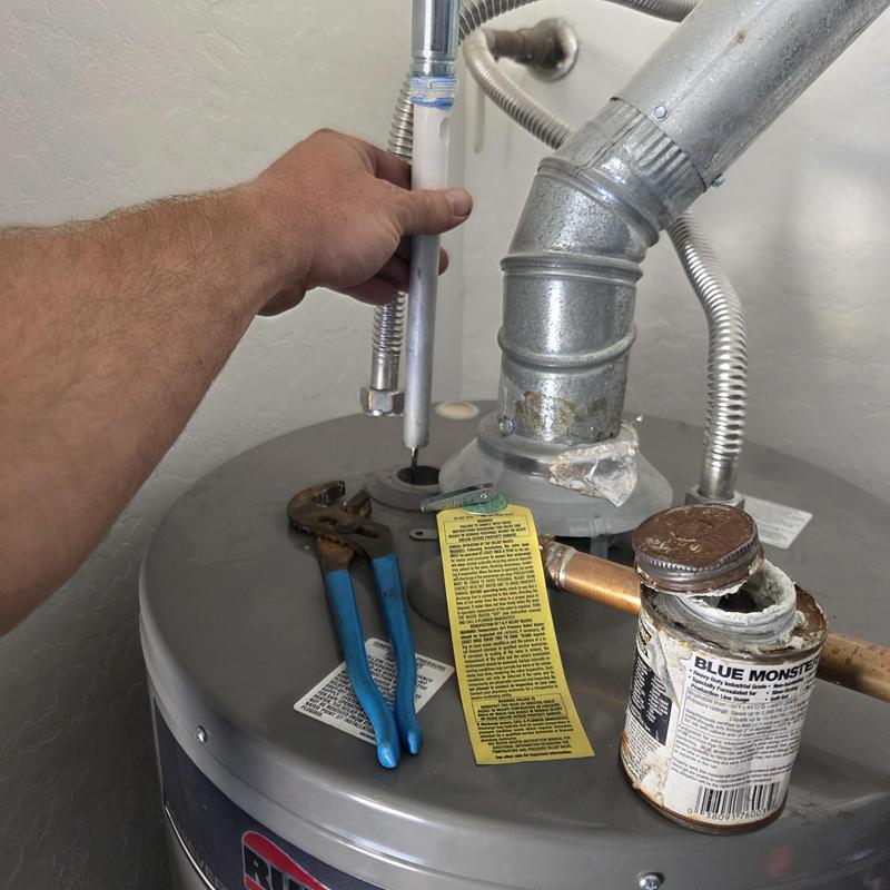Gas water heater anode rod replacement in progress