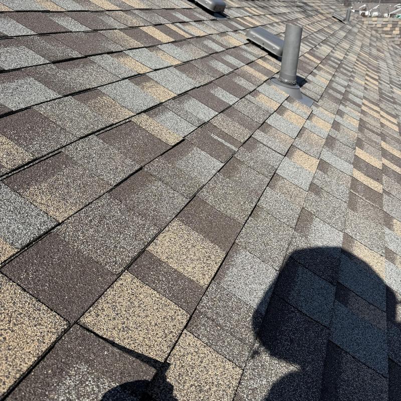 Asphalt shingle roof with vent pipe and shadow Asphalt shingle roof with vent pipe and shadow