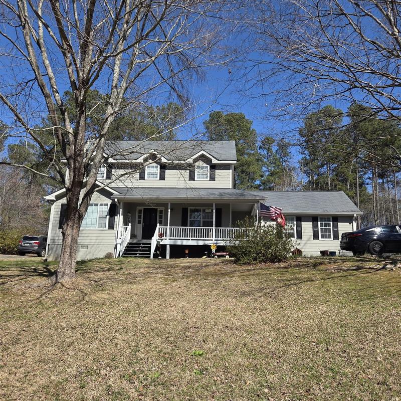 Wall flashing and roof valley caulking on house exterior