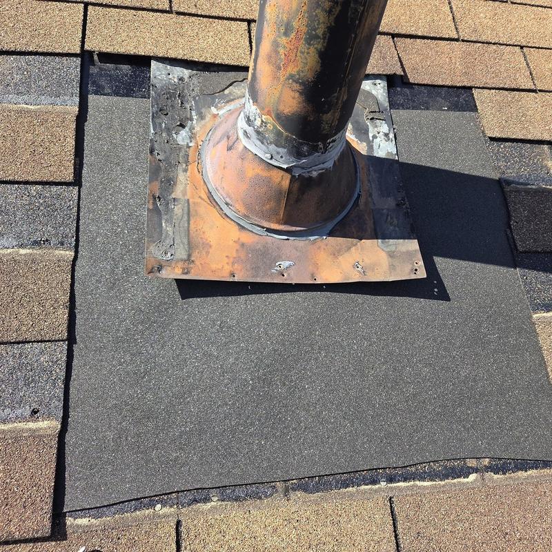 Vent pipe flashing with replaced shingles and caulking