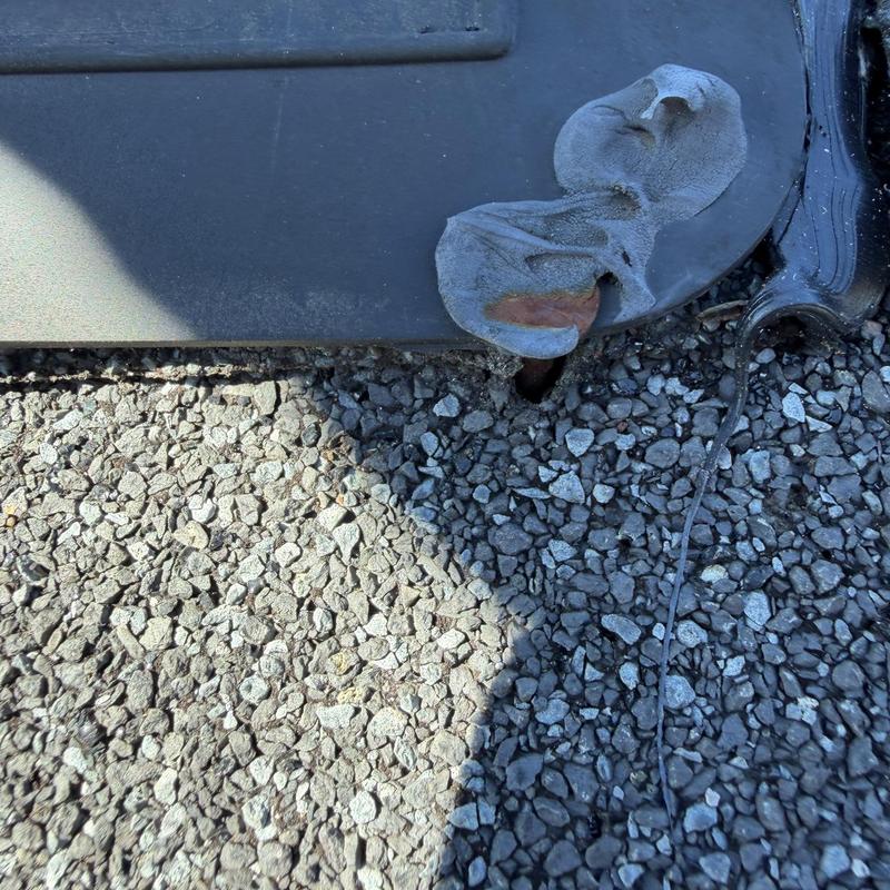 Box vent on gravel roof with damaged shingles