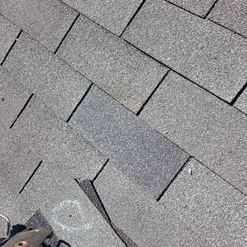 Box vent and asphalt shingles on roof surface