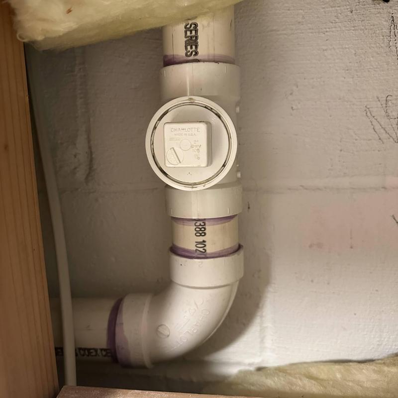 PVC sewer cleanout pipe with cap installation