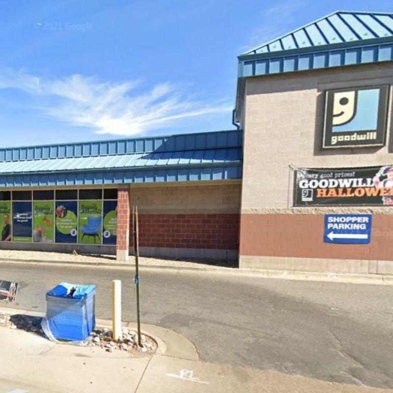 Metal roof with rust and clogged gutters at Goodwill building Metal roof with rust and clogged gutters at Goodwill building