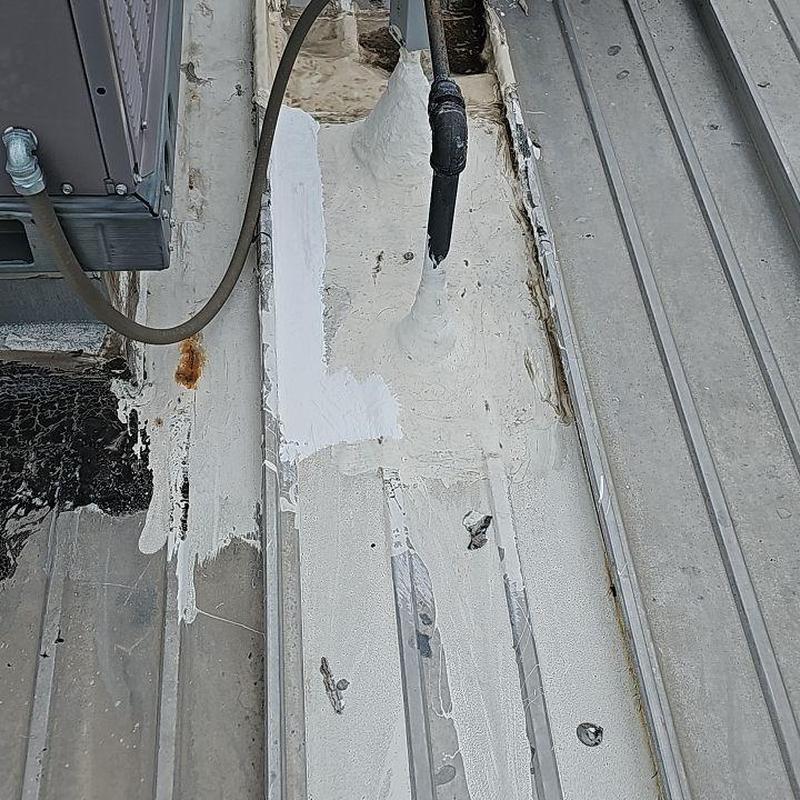 Metal flat roof with rust and patch coating Metal flat roof with rust and patch coating