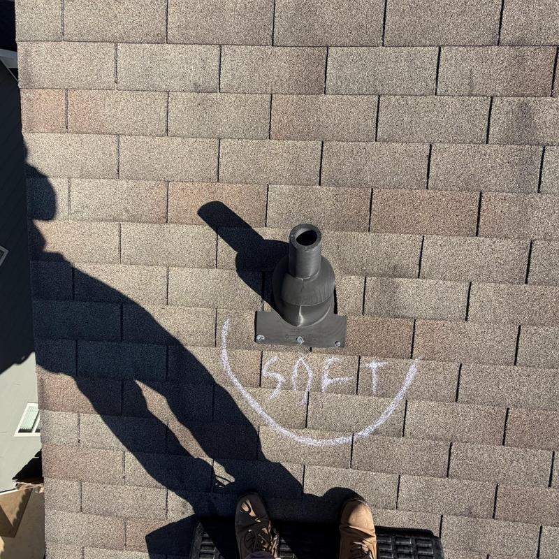 Pipe boot on asphalt shingle roof with chalk markings