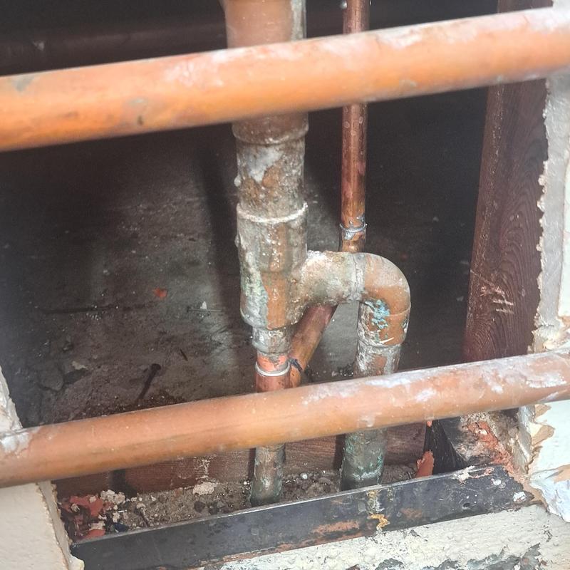 Copper water pipes corrosion and reroute under slab