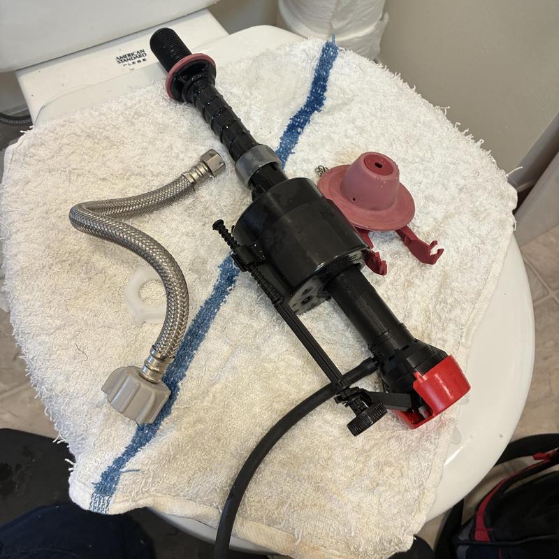 Toilet fill valve and flapper on towel