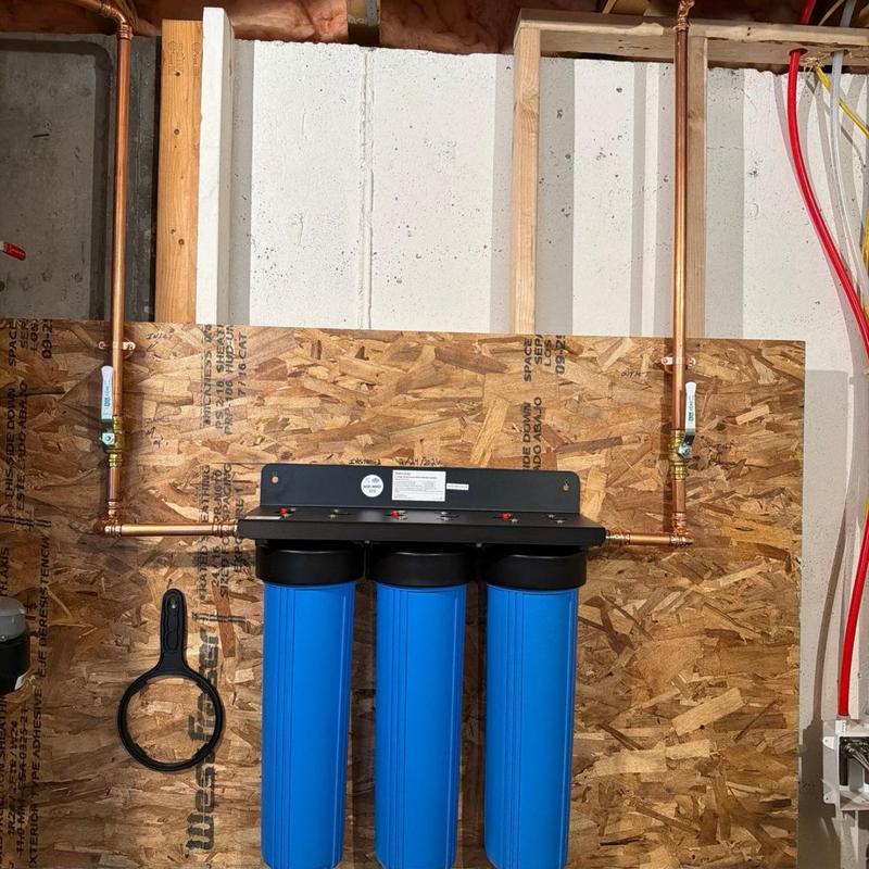 3-filter water filtration system installation with copper piping