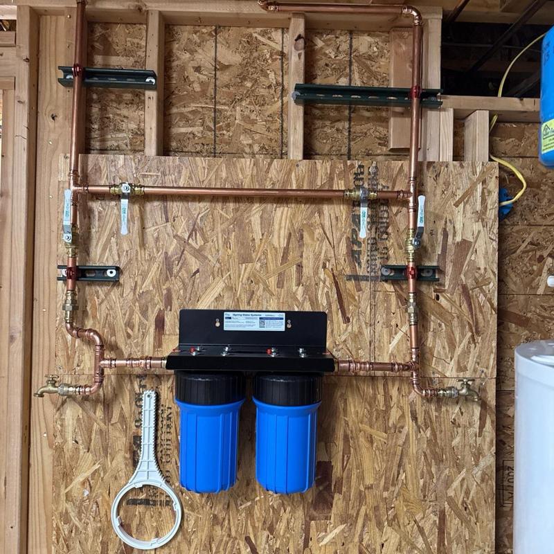 Two-filter water filtration system with bypass valves