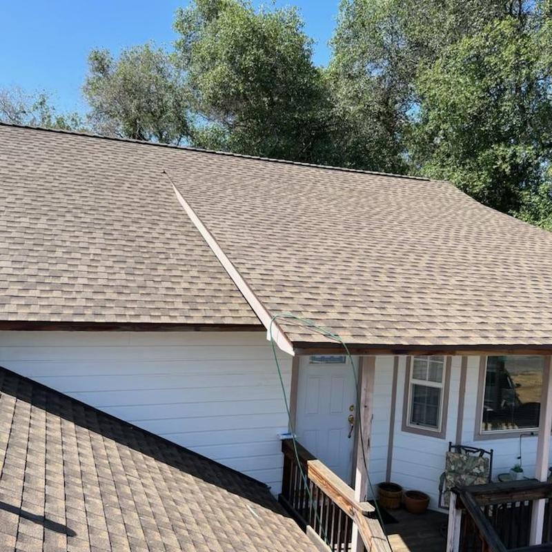Seamless steel gutters with leaf blaster guards installed