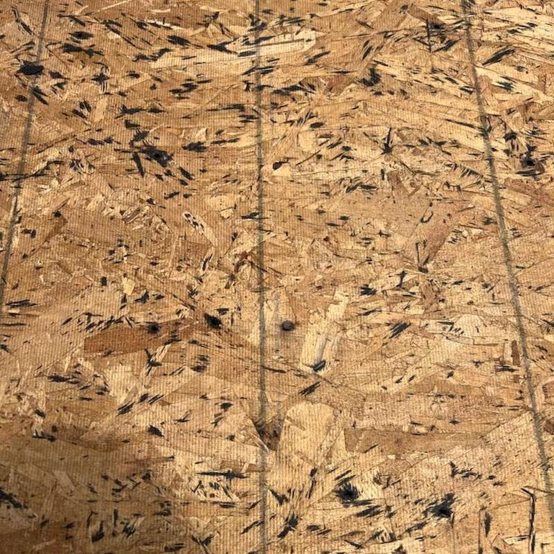 OSB roof decking with repair markings