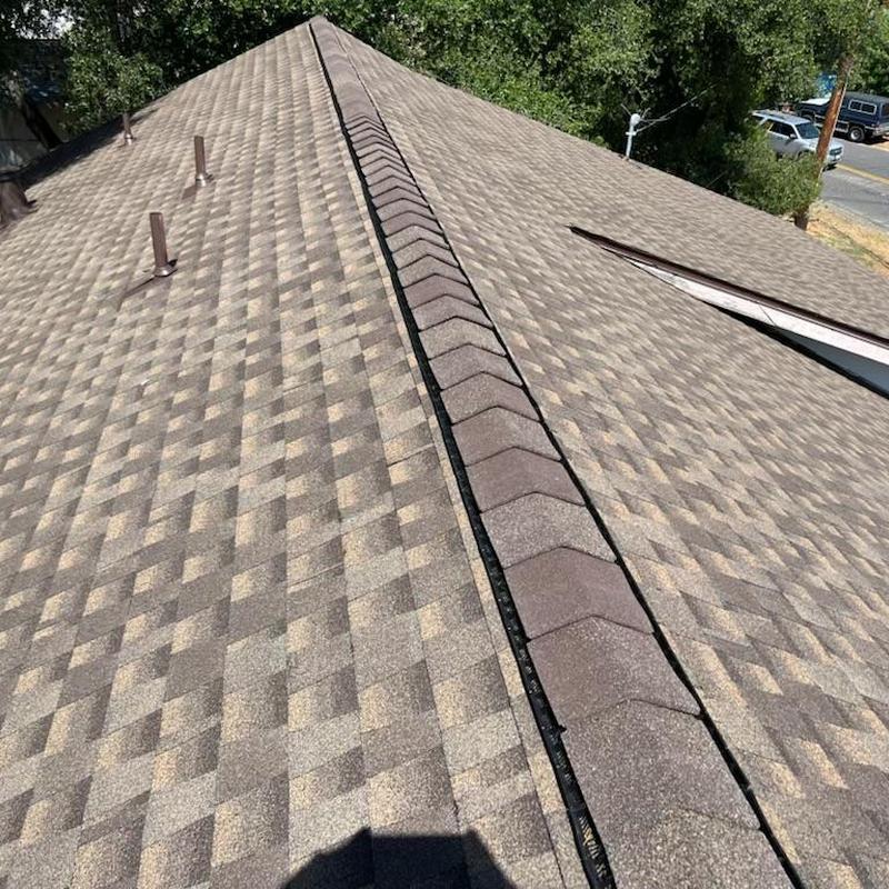 Asphalt shingle roof with new ridge cap and vents