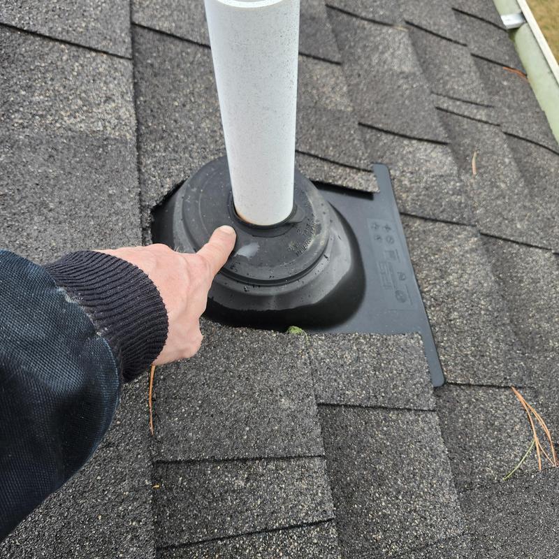 Pipe boot on shingle roof with damage inspection