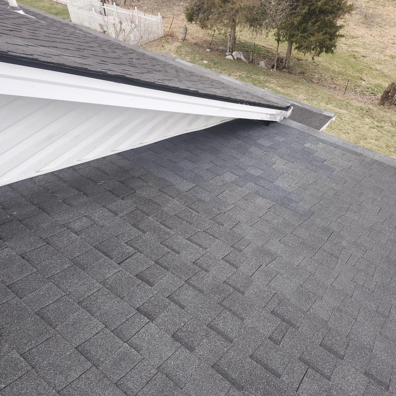 Garage wall reflashing and roof shingles in Blountville