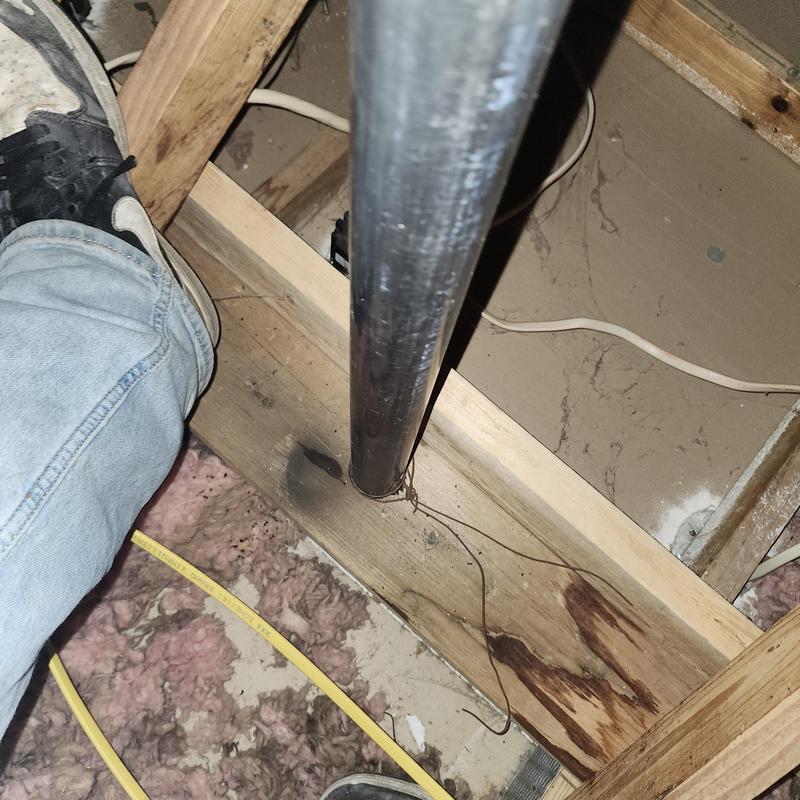 Unused metal pipe causing water leak in attic floor