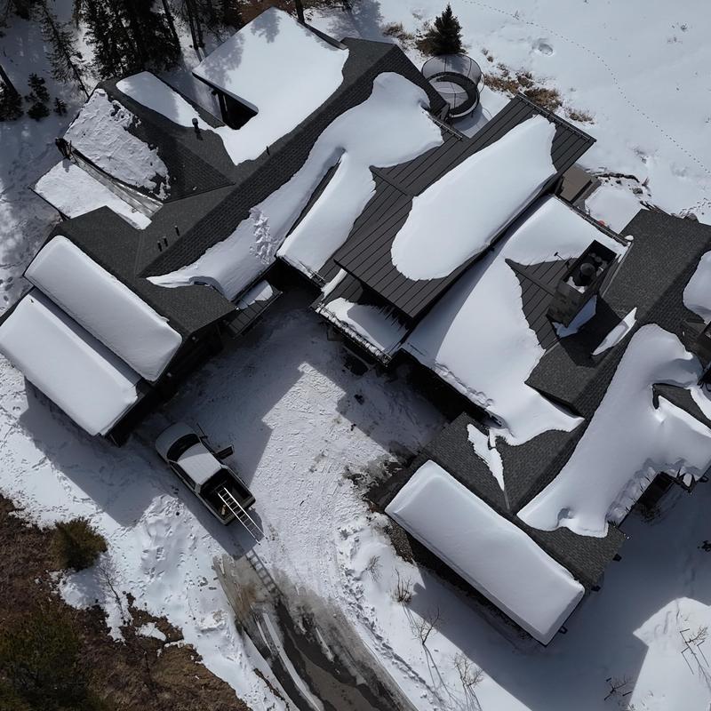 Standing seam metal roof with snow cover and heat tape inspection Standing seam metal roof with snow cover and heat tape inspection