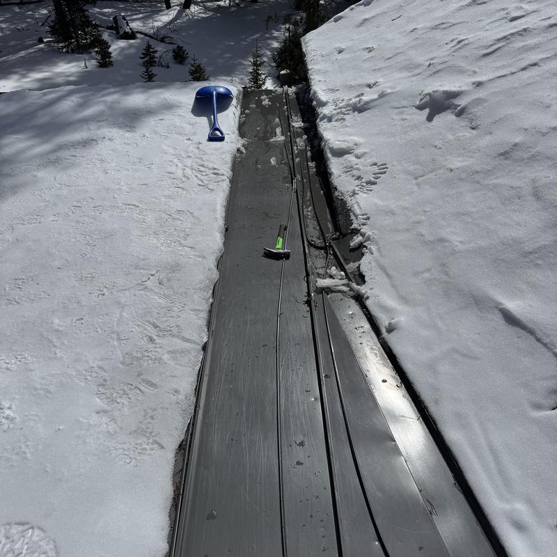 Standing seam metal roof with heat tape inspection in snow Standing seam metal roof with heat tape inspection in snow