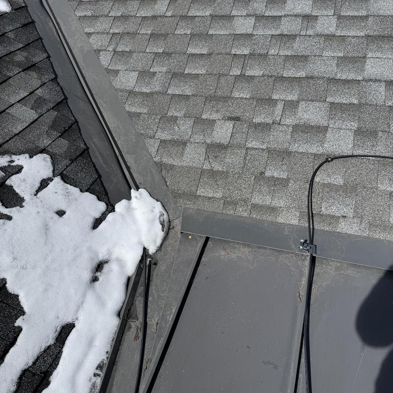 Heat tape and metal roof with snow buildup Heat tape and metal roof with snow buildup