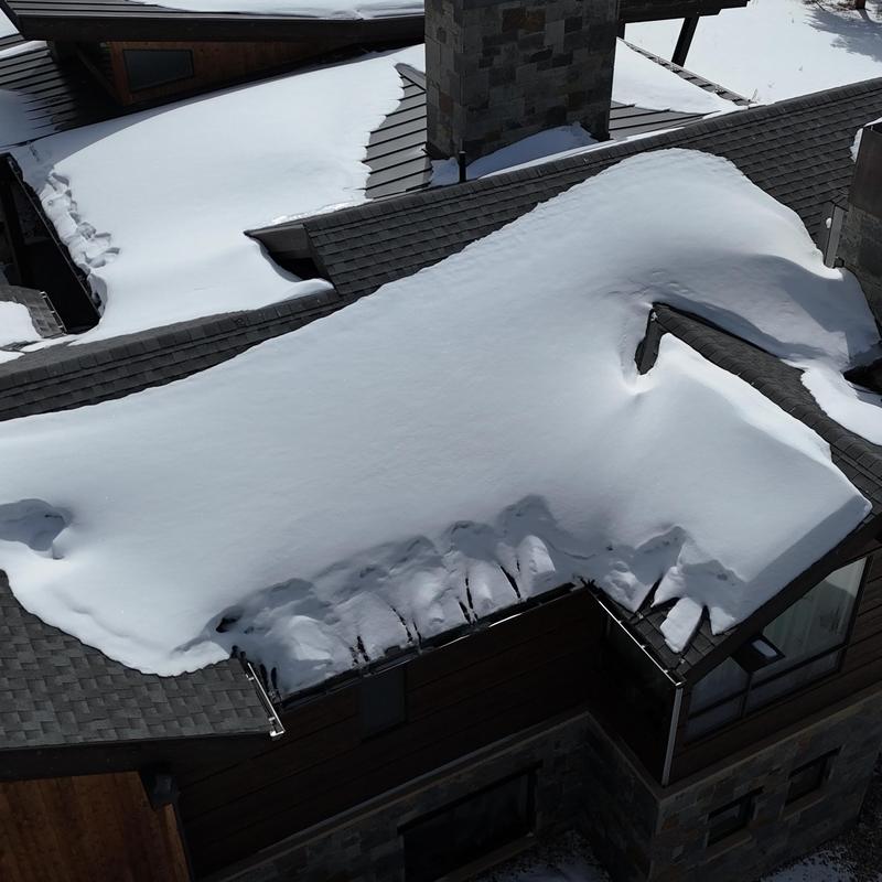 Standing seam metal roof with snow accumulation Standing seam metal roof with snow accumulation