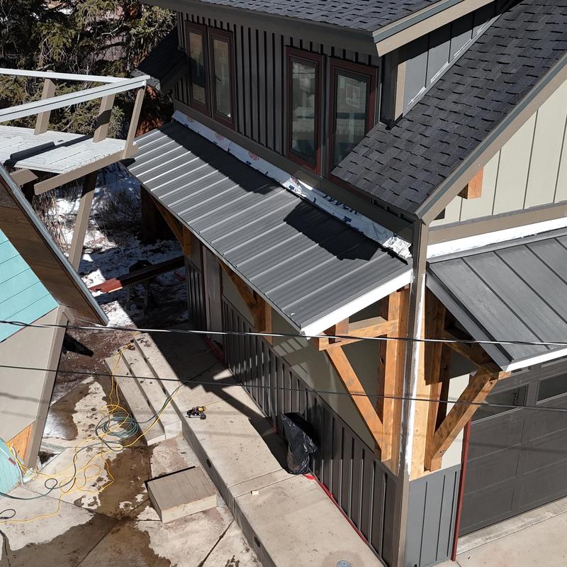 Metal shed roof installation with wooden supports Metal shed roof installation with wooden supports