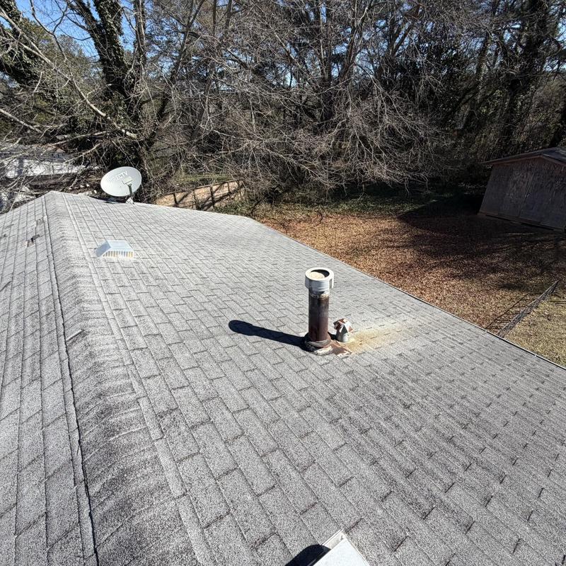 Asphalt shingle roof replacement with vent pipe installation