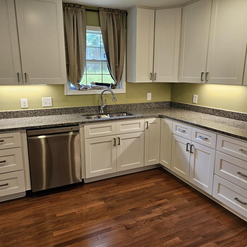 Kitchen cabinets and granite countertops with stainless sink Kitchen cabinets and granite countertops with stainless sink