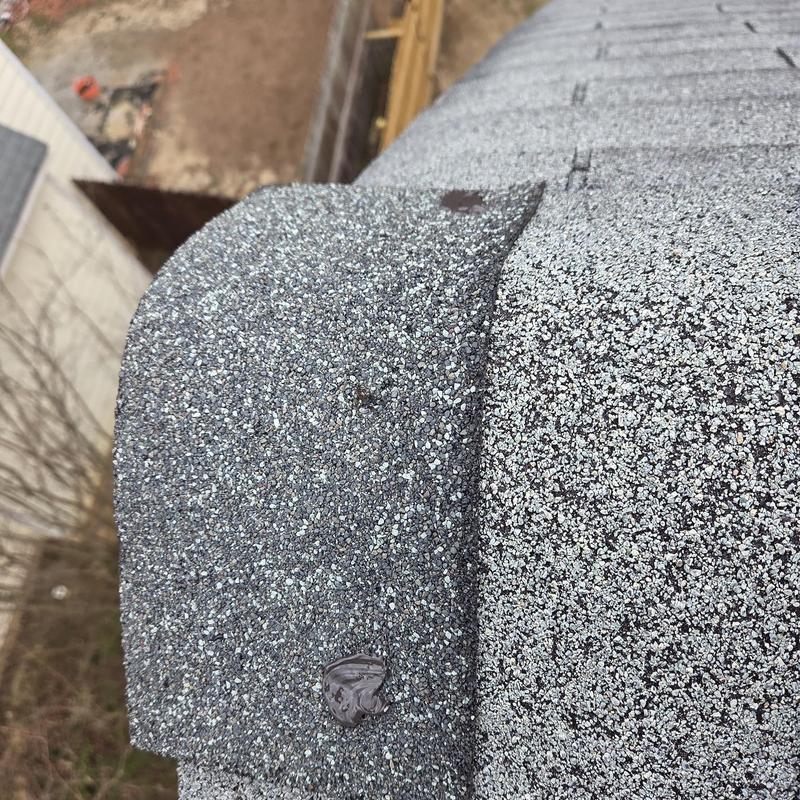 Roof shingles with new caulking on edge seam