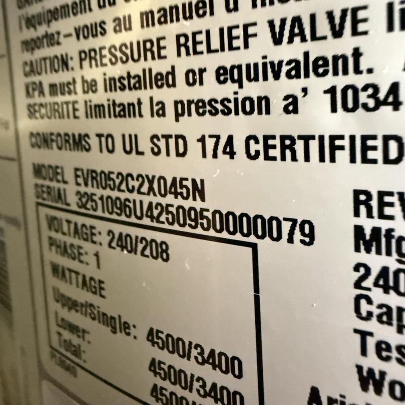 Water heater pressure relief valve label close-up Water heater pressure relief valve label close-up