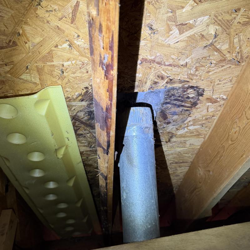 Dryer vent pipe with roof leak in attic space