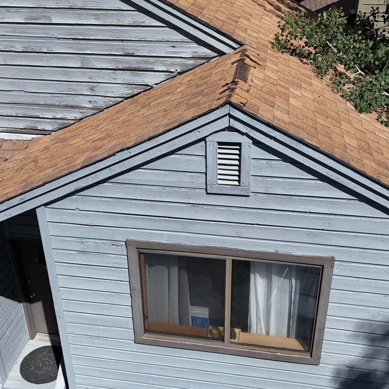 Asphalt shingle roof inspection on residential house Asphalt shingle roof inspection on residential house