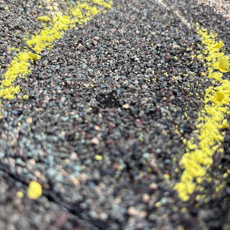 Asphalt shingle hail damage marked with yellow chalk