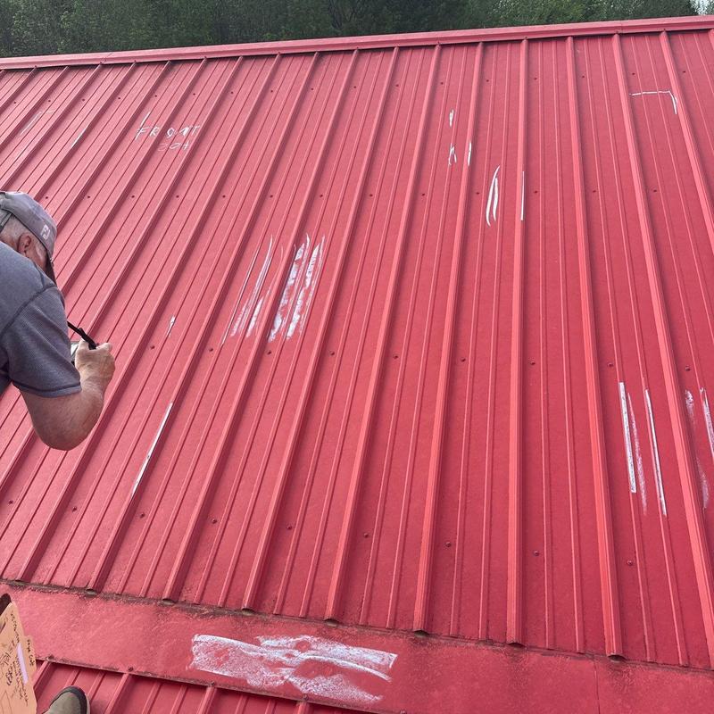 Metal roof panel hail damage inspection with markings