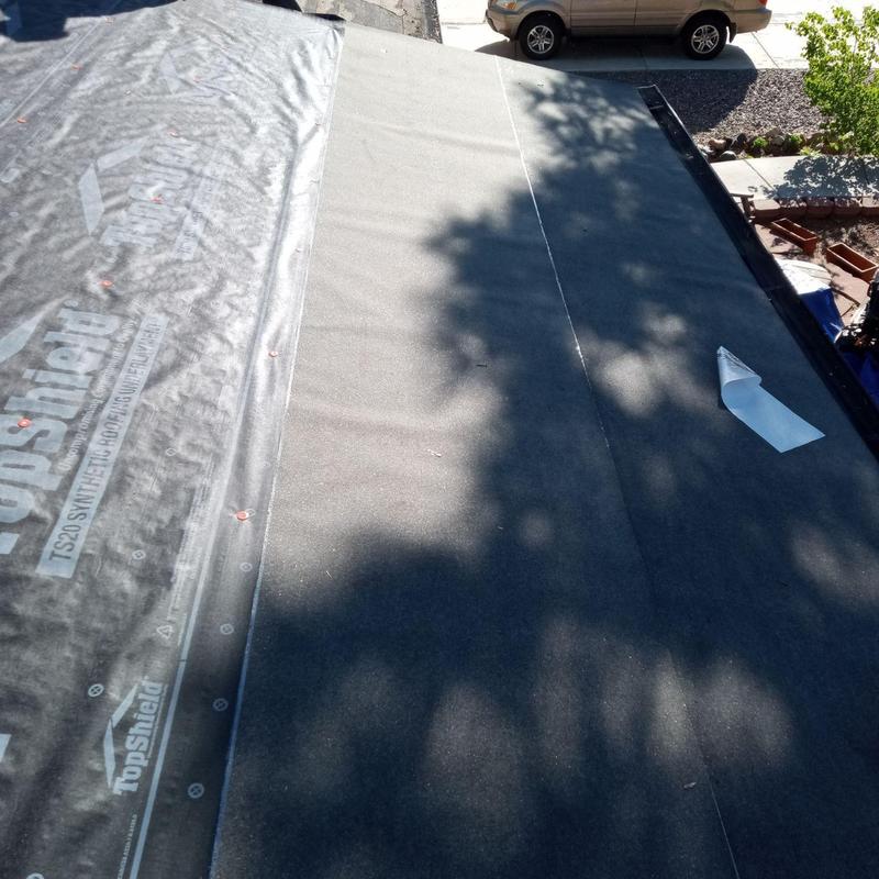 Synthetic underlayment installation on flat roof deck Synthetic underlayment installation on flat roof deck
