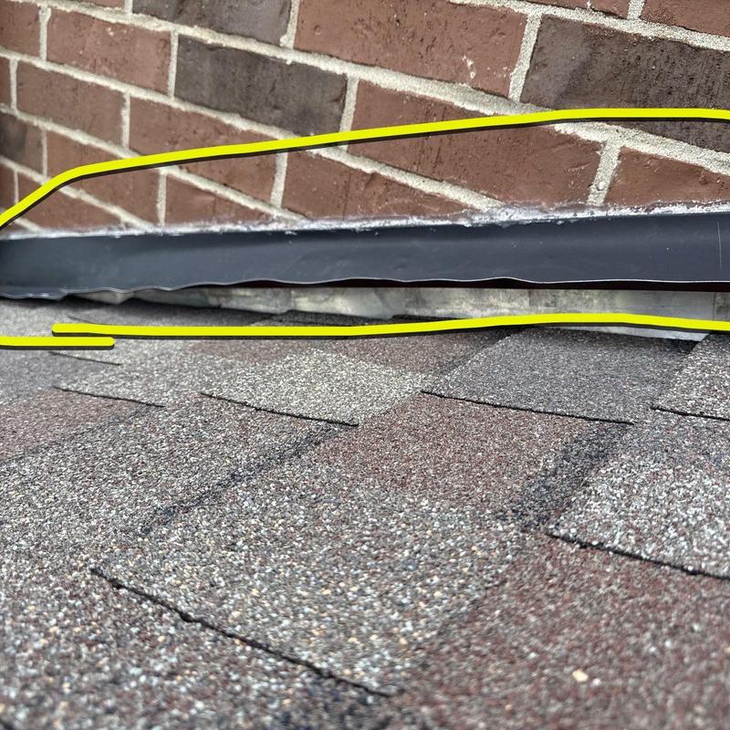 Roof flashing gap and damaged asphalt shingles