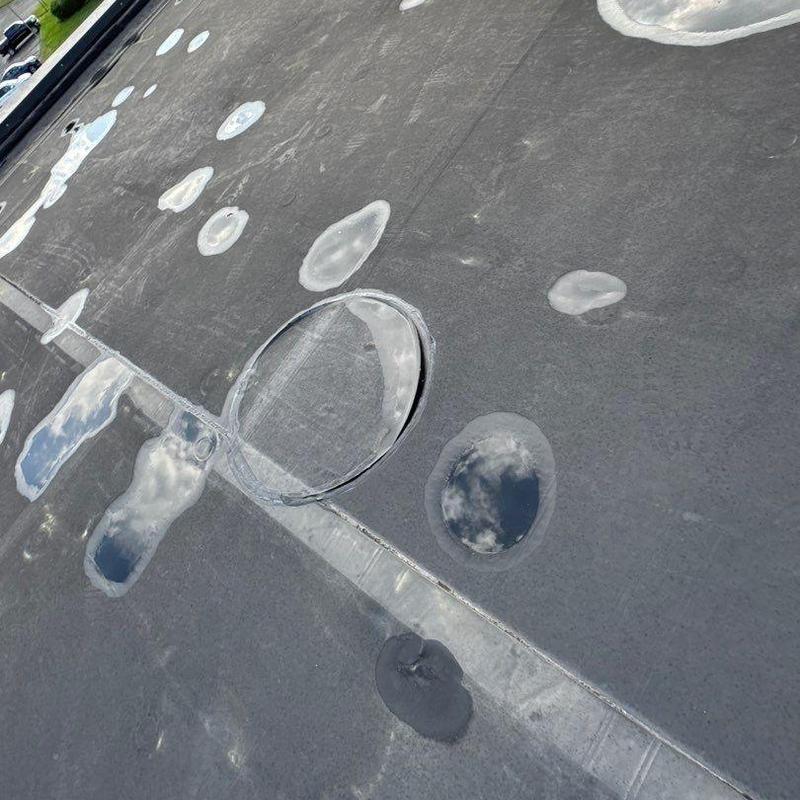 Commercial flat roof hail damage patches and sealant repairs