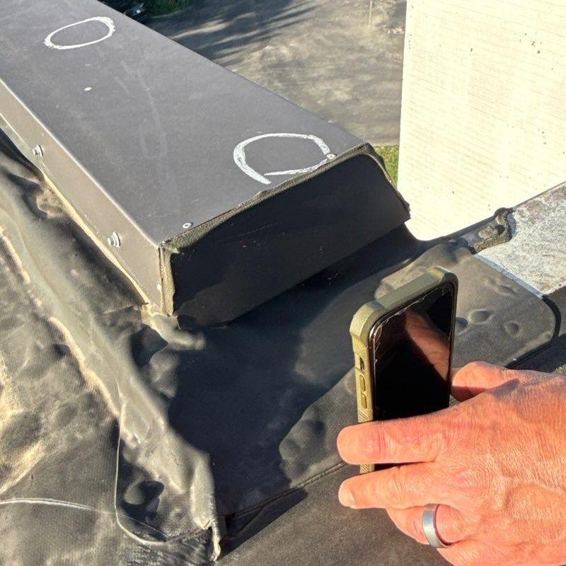 Roof flashing with hail damage inspection marks