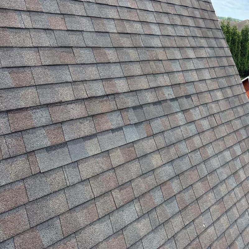 Asphalt shingle roof with hail damage inspection