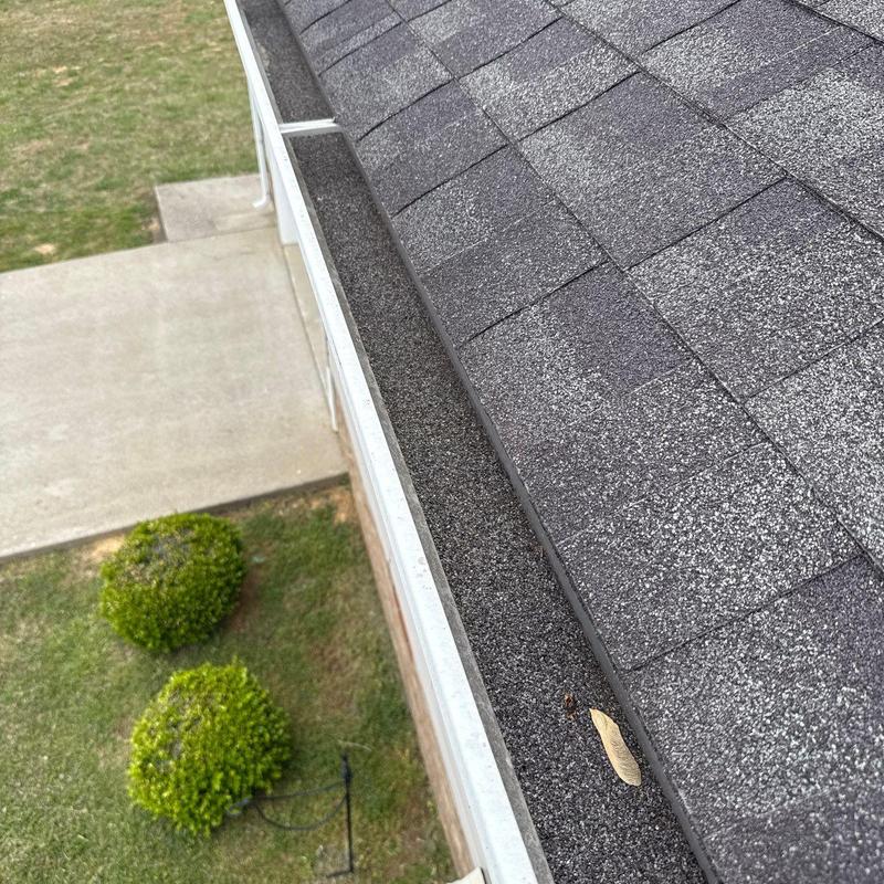 Asphalt shingle roof with gutter and ridge inspection