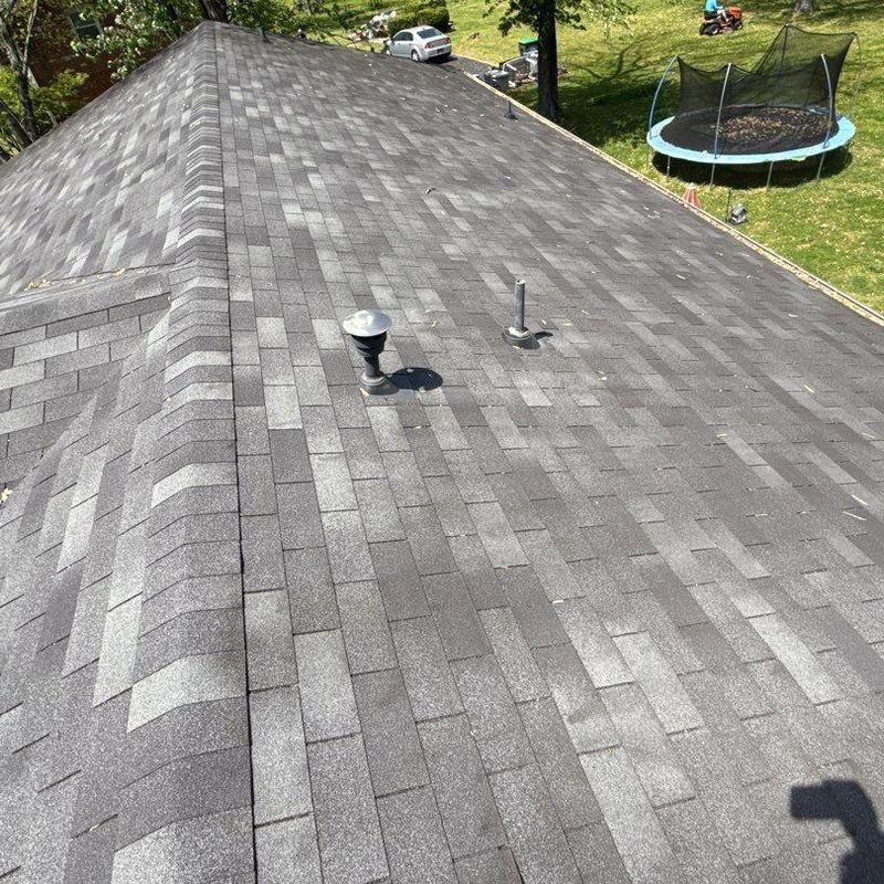Asphalt shingle roof with ridge cap and vents inspection