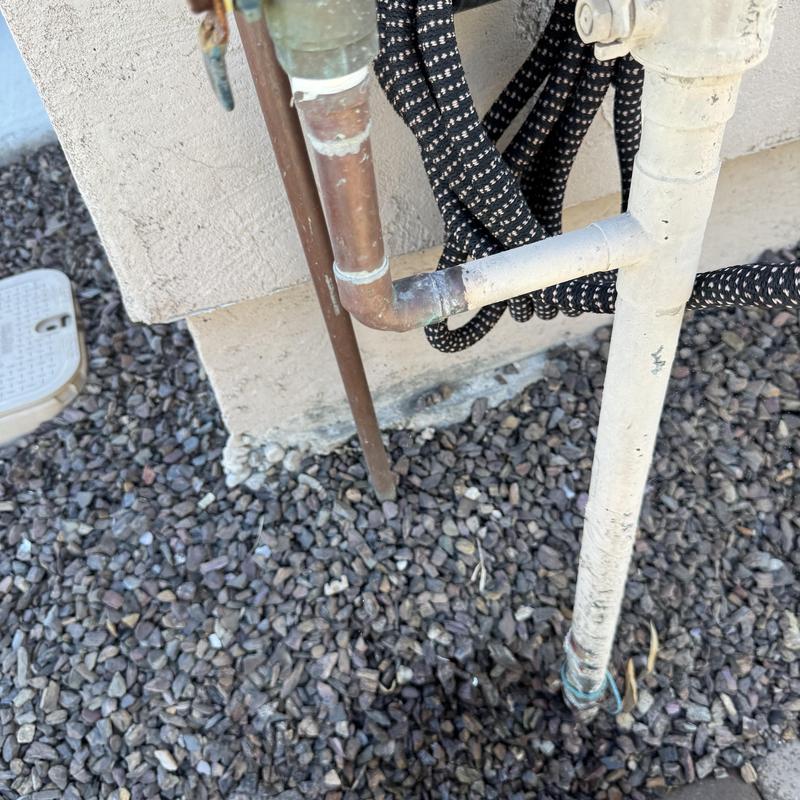 Pressure vacuum breaker pipe with pinhole leak repair